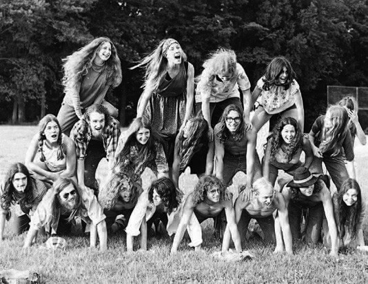 Black and white photo of two dozen students on Antioch campus